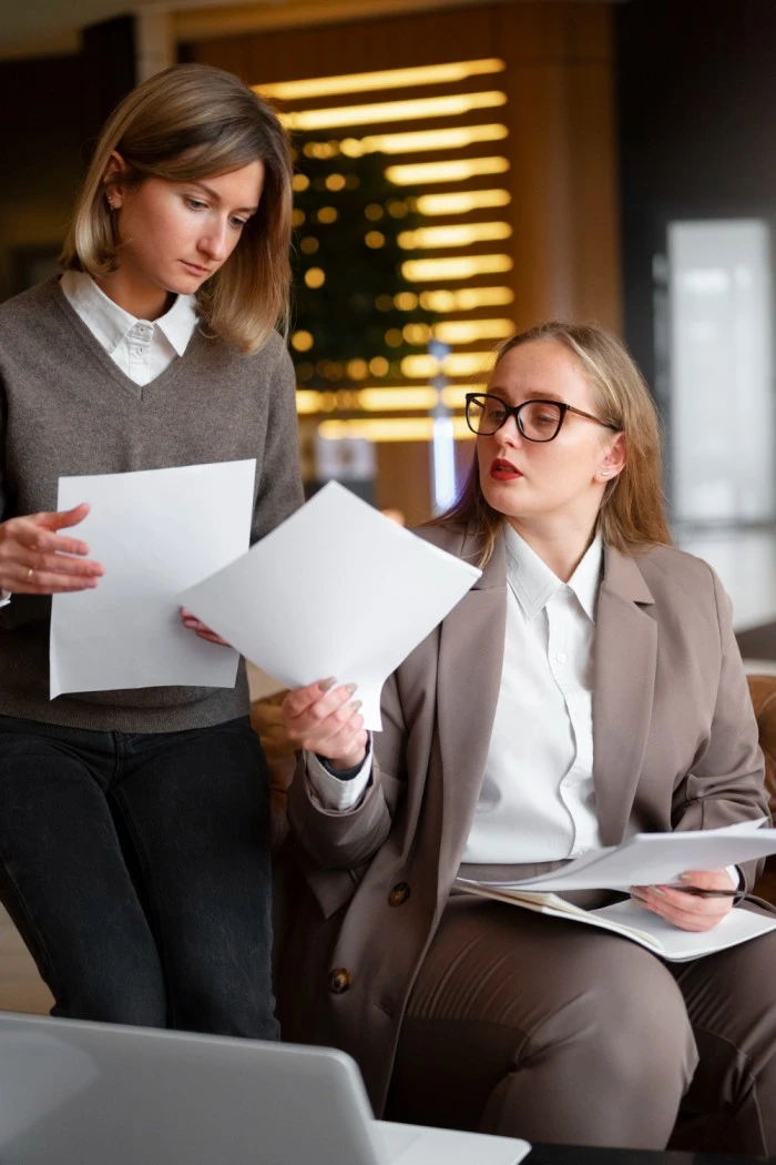 HR professionals reviewing statutory compliance documents for labor law and audit preparation
